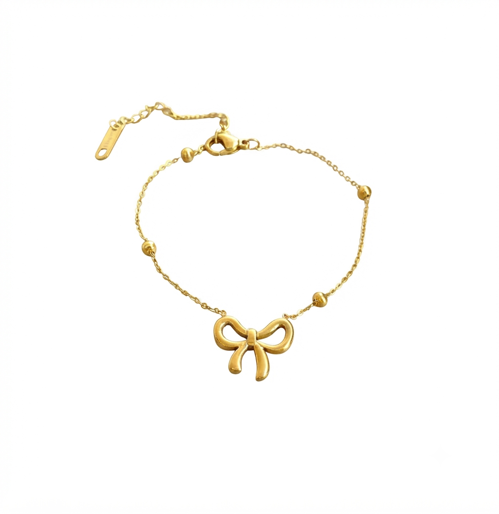 Baño de oro 18k.241 Pulsera de moñita con perlitas doradas