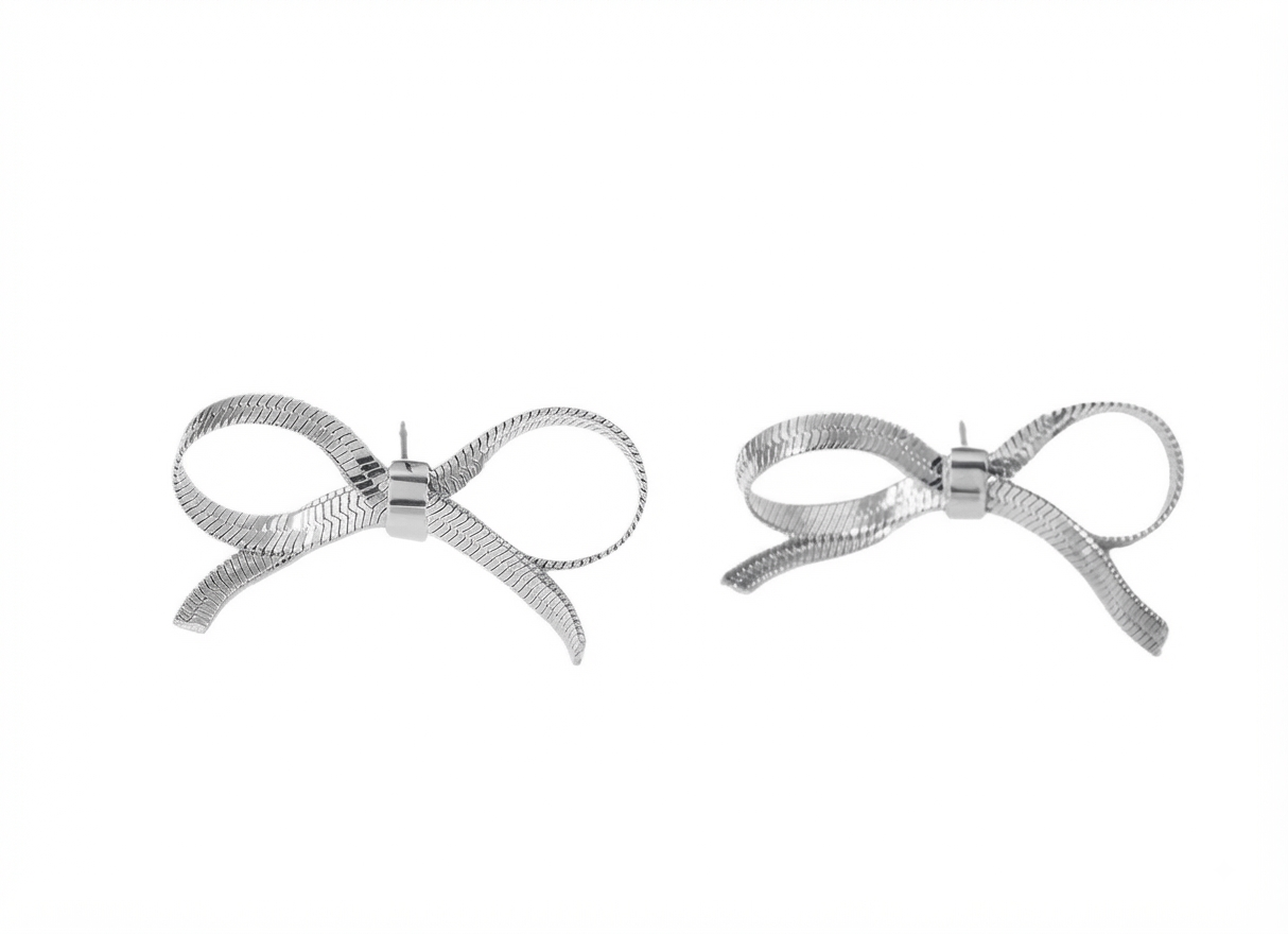 Baño de oro 18K.100 Aretes plateados de moñita