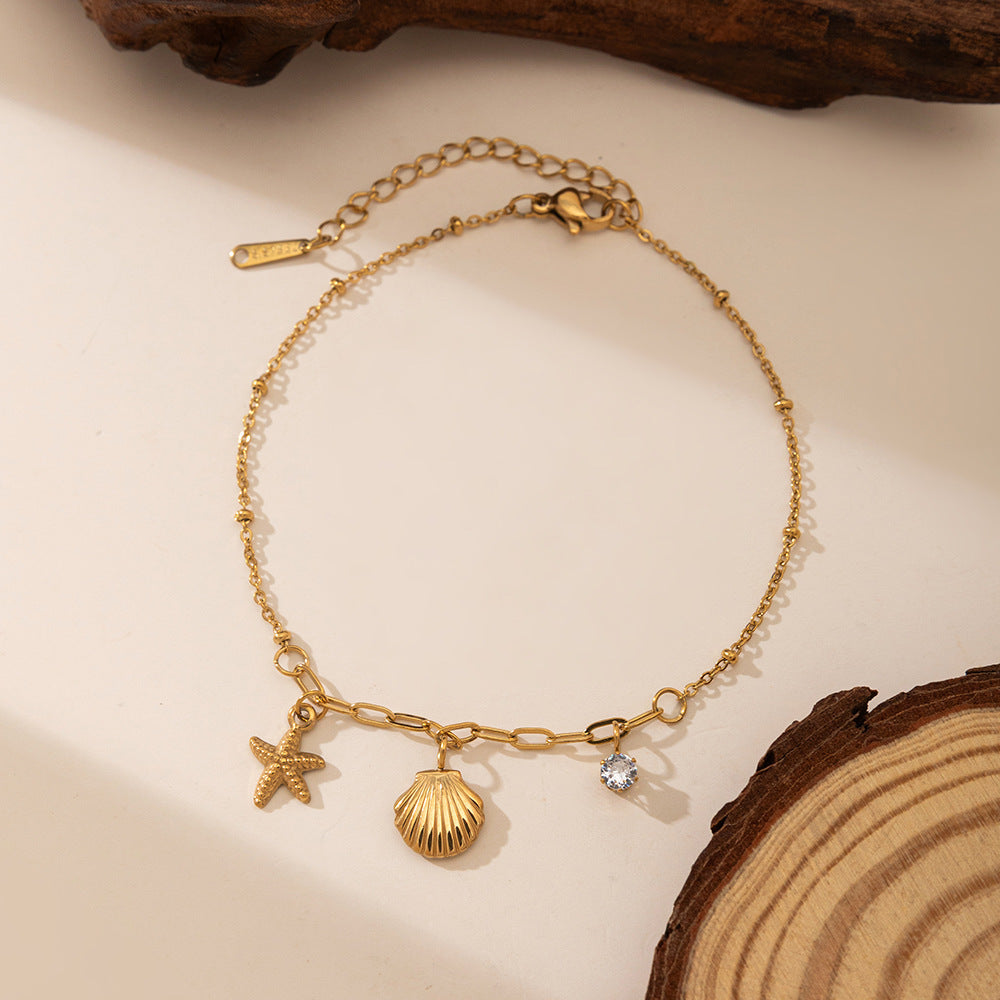 Baño de oro 18k.273 Pulsera de diamante, estrella y concha de mar