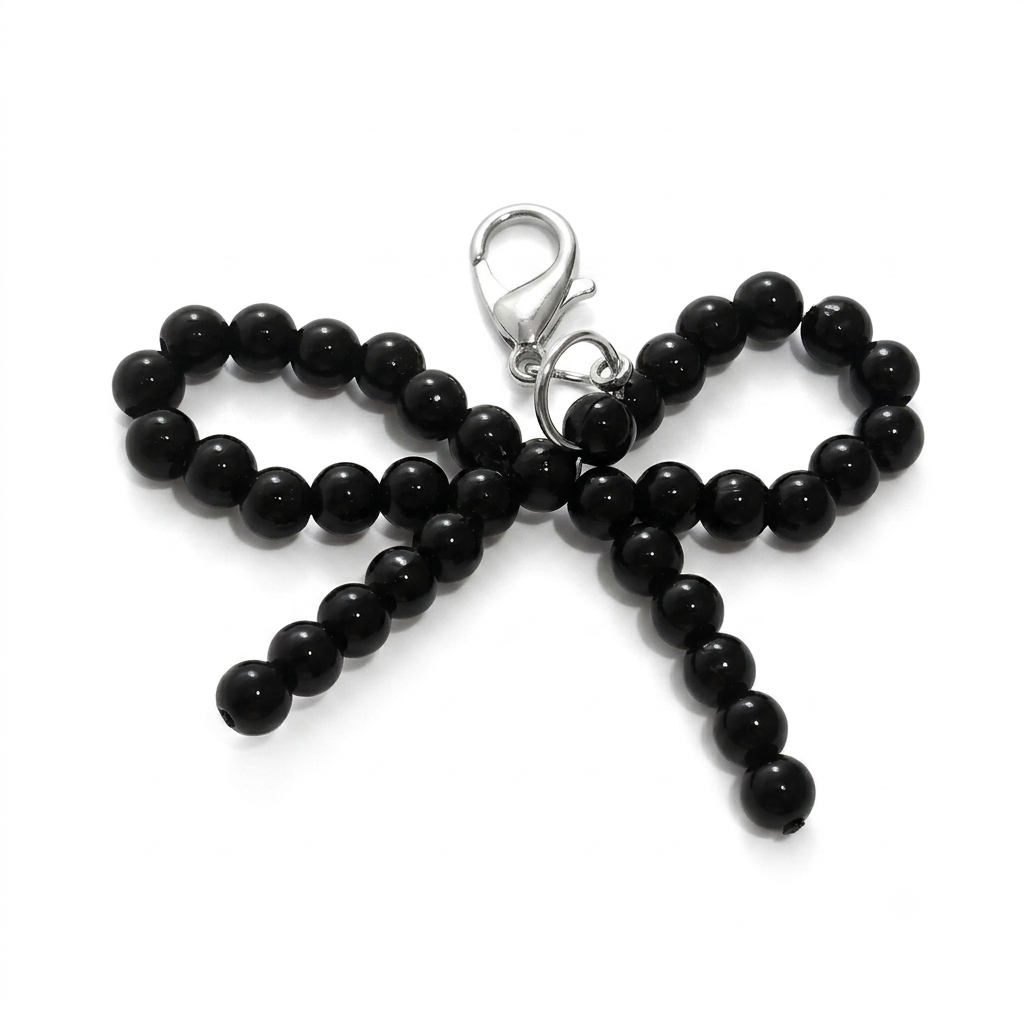 CHARM.5 Charm de tenis moñita negra