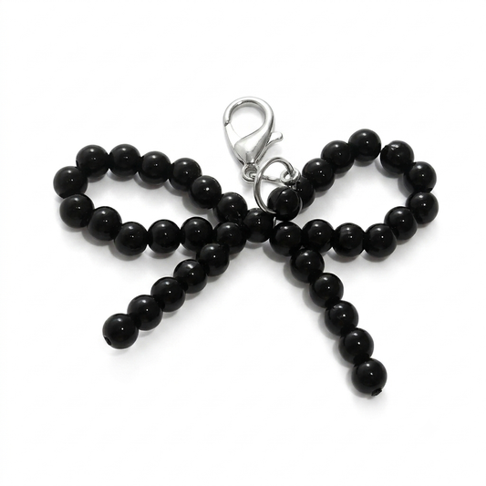 CHARM.5 Charm de tenis moñita negra