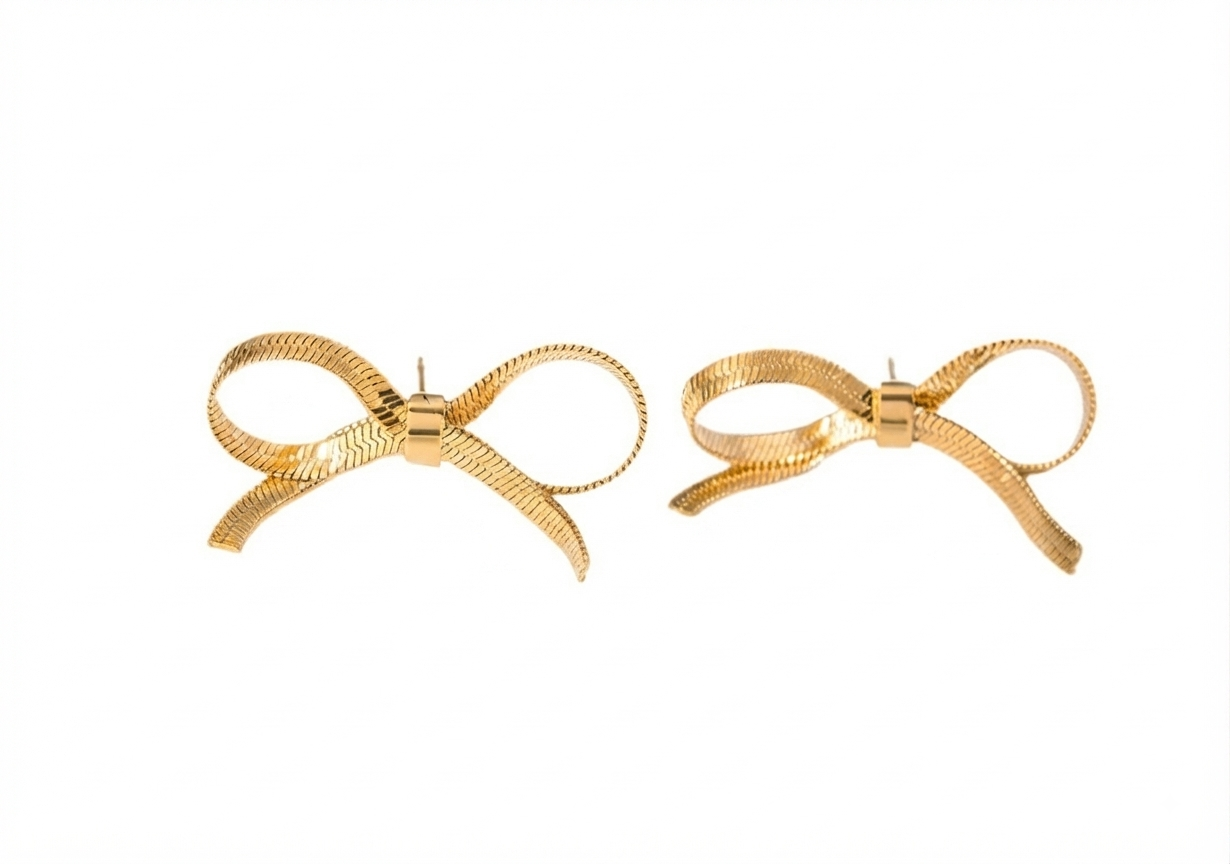 Baño de oro 18K.99 Aretes dorados de moñita