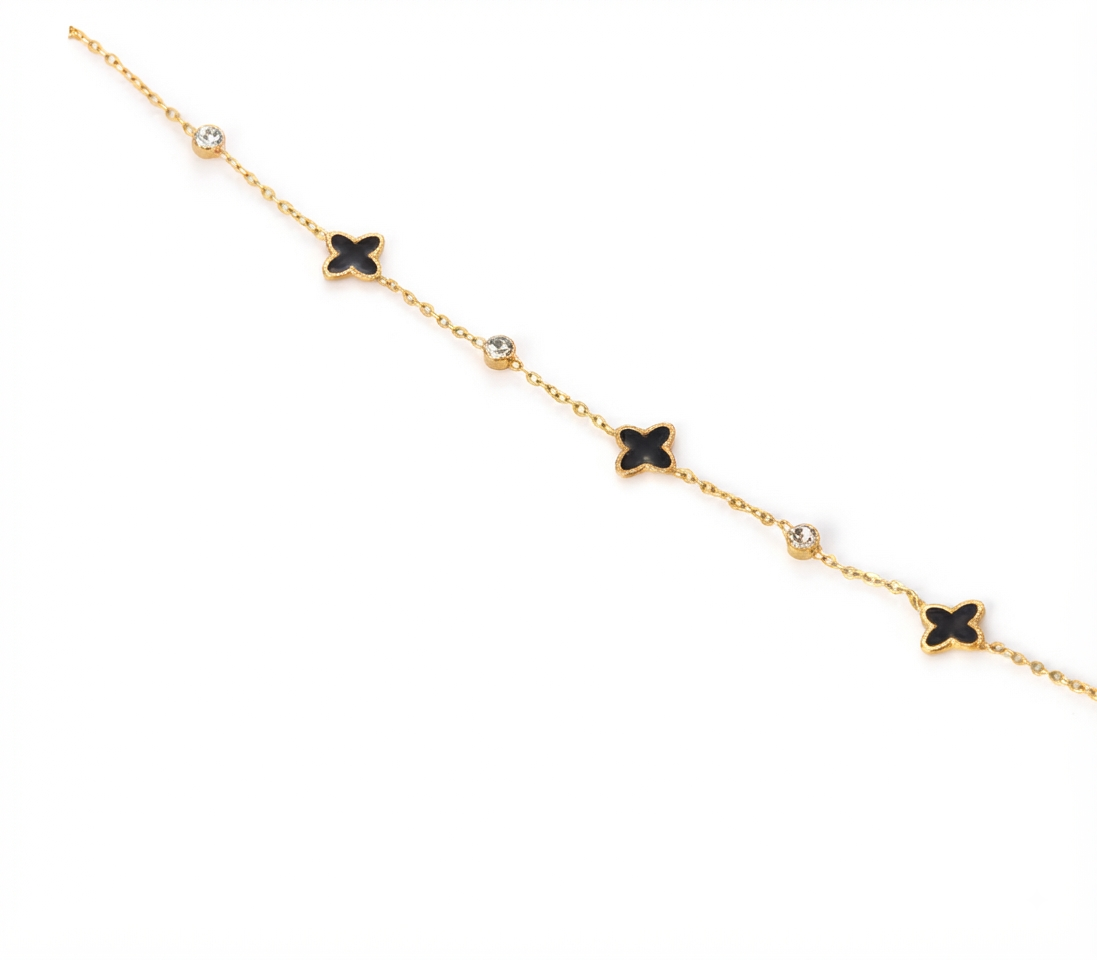 Baño de oro 18K.53Pulsera dorada con florecitas negras