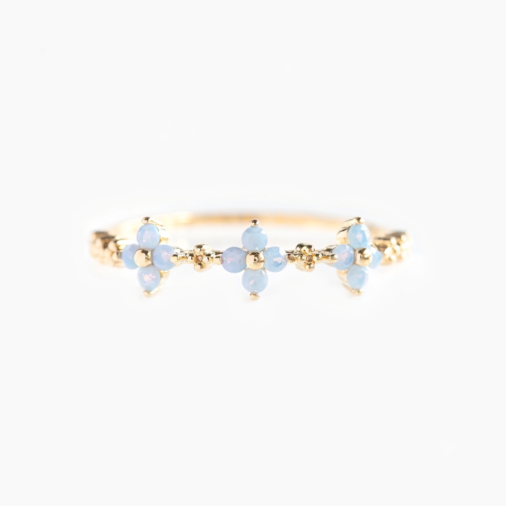Baño de oro 18k.301 Anillo de florecitas celestes