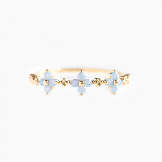 Baño de oro 18k.301 Anillo de florecitas celestes