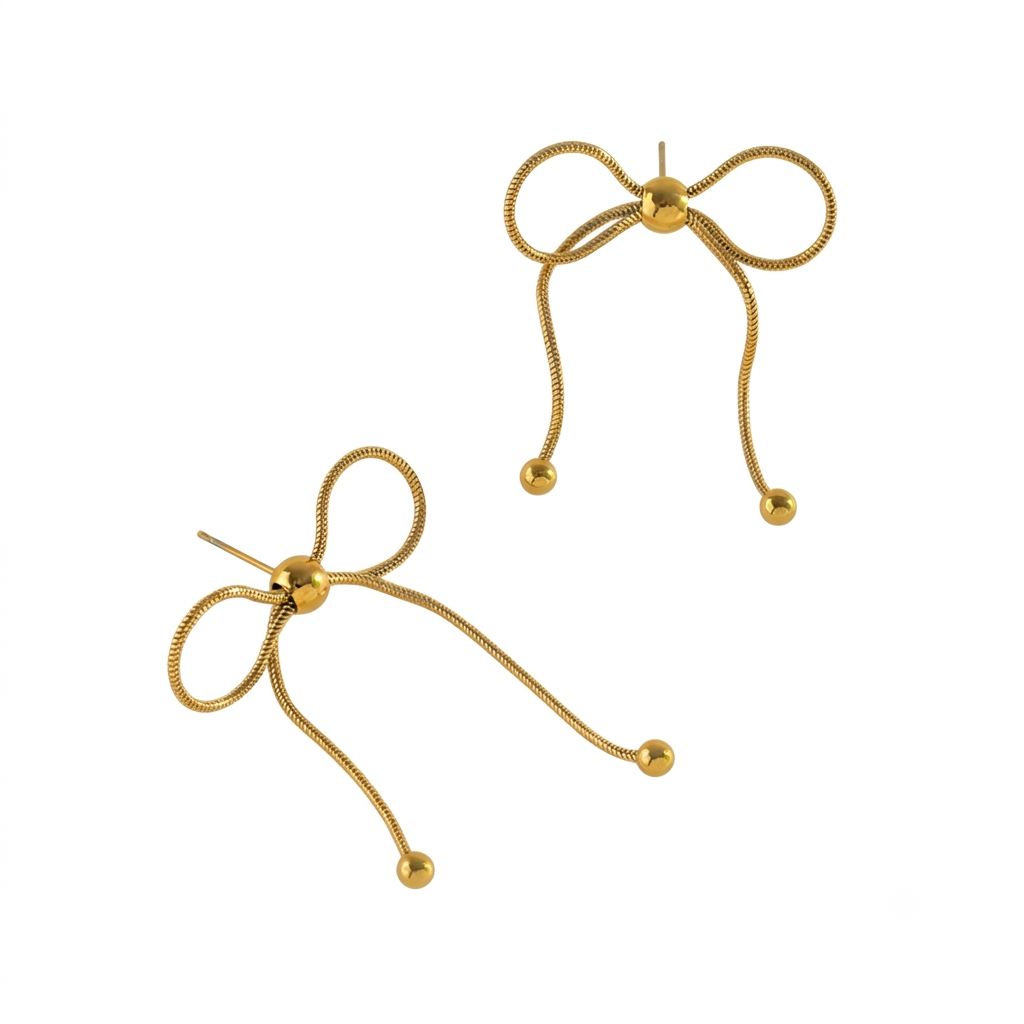 Baño de oro 18k.254 Aretes de moña con perlita dorada