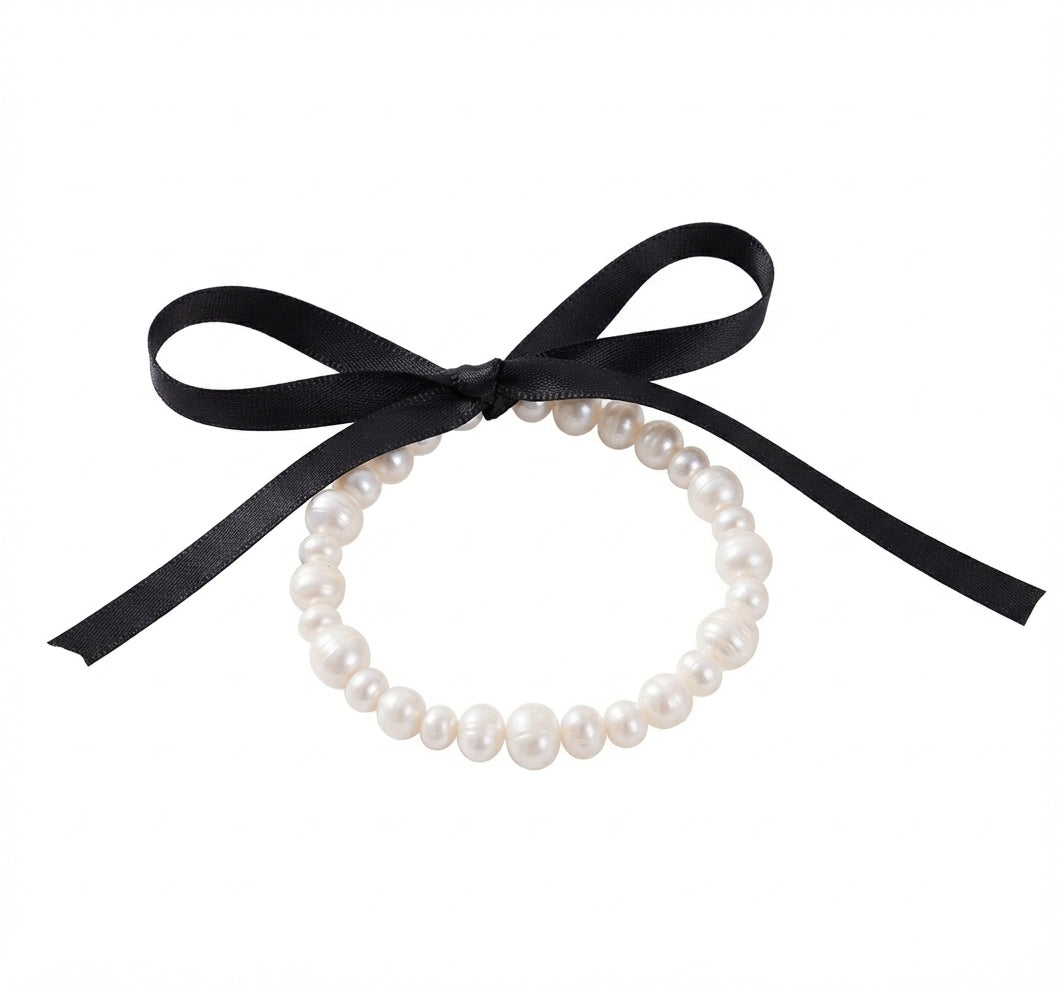 Fantasía fina PUL.50 Pulsera de perlitas y moña negra
