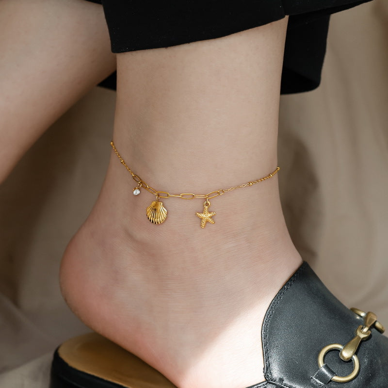 Baño de oro 18k.253 Tobillera de diamante, conchita y estrella de mar