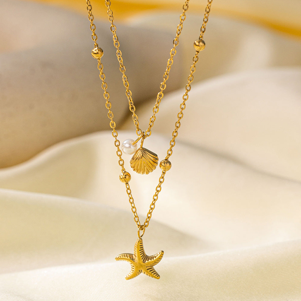 Baño de oro 18k.272 Collar doble de perla, concha y estrella de mar