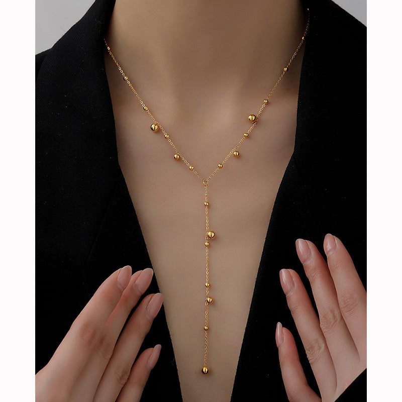 Baño de oro 18k.206 Collar largo de perlas doradas